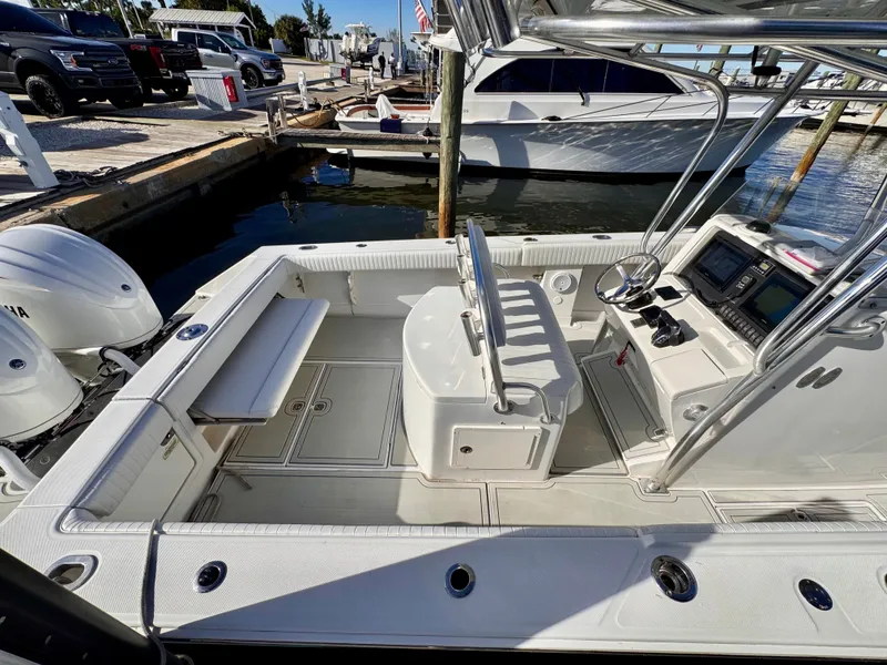 Slide: The Image of 2008 Jupiter 30 boat interior with dual engines, docked at marina. - 21