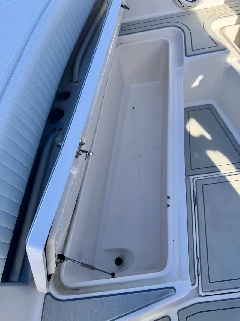 Slide: The Image of Open storage compartment on a 2008 Jupiter 30 boat deck. - 35