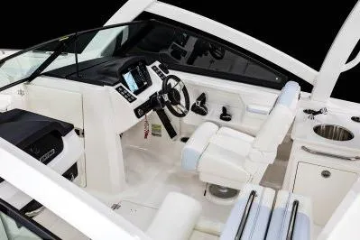 Slide: The Image of 2026 Robalo R257 Dual Console boat interior with modern dashboard and seating. - 13