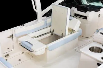 Slide: The Image of 2026 Robalo R257 Dual Console boat interior with versatile seating and storage. - 16