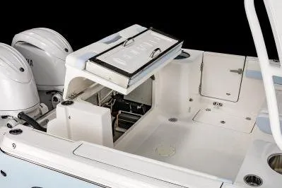 Slide: The Image of 2026 Robalo R257 Dual Console boat interior with open storage compartments. - 19