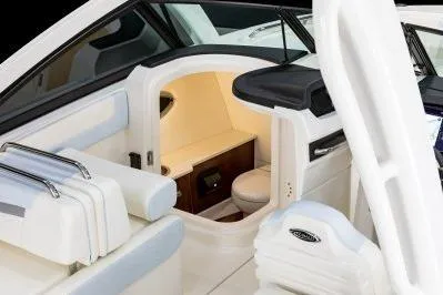 Slide: The Image of 2026 Robalo R257 Dual Console interior with seating and cabin view. - 9