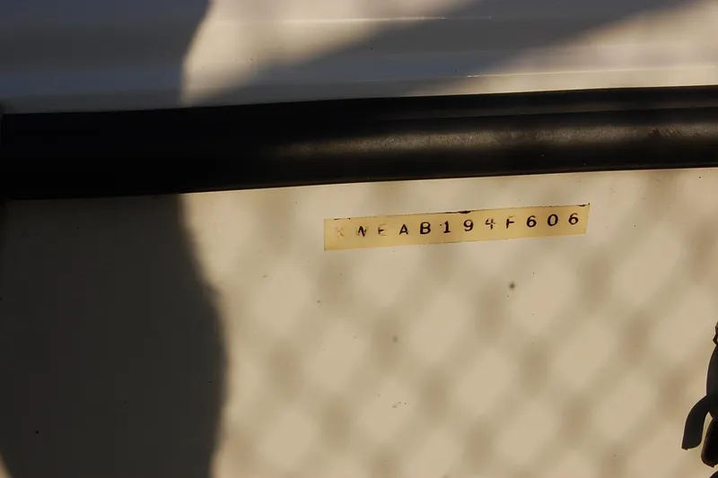 Slide: The Image of 2006 KEYWEST 152 boat hull identification number, shadowed surface. - 7