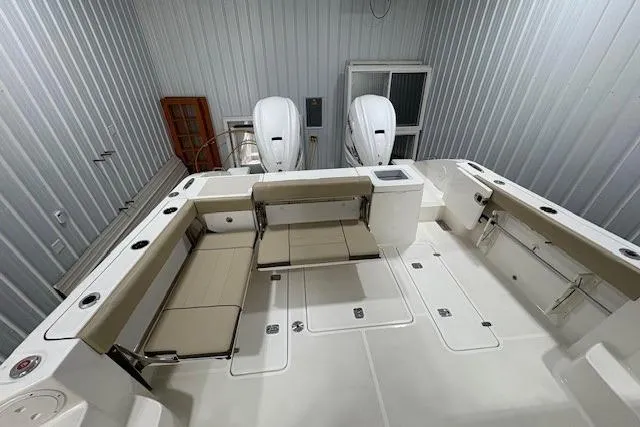 Slide: The Image of Open storage compartment on 2021 Pursuit OS 355 Offshore boat interior. - 13