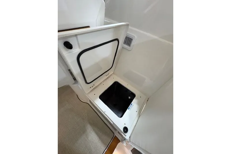 Slide: The Image of 2021 Pursuit OS 355 Offshore boat interior compartment detail. - 14