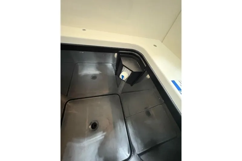 Slide: The Image of 2021 Pursuit OS 355 Offshore helm with modern controls and comfortable seating. - 15