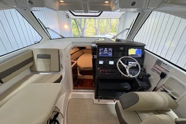 Slide: The Image of 2021 Pursuit OS 355 Offshore boat in storage, showcasing sleek design and modern features. - 18