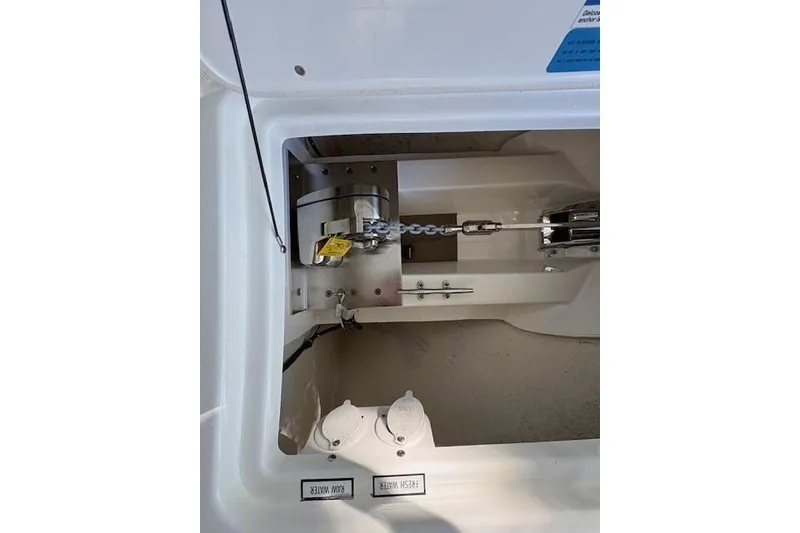 Slide: The Image of 2021 Pursuit OS 355 Offshore boat with Garmin radar in a metal storage facility. - 20