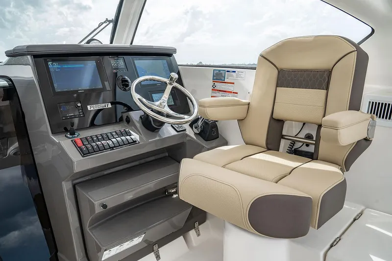 Slide: The Image of Manufacturer Provided Image: Interior of 2021 Pursuit OS 355 Offshore boat with modern kitchen and wooden flooring. - 3