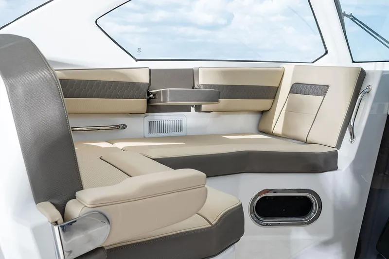 Slide: The Image of Manufacturer Provided Image: 2021 Pursuit OS 355 Offshore boat interior seating area with beige and gray upholstery. - 45