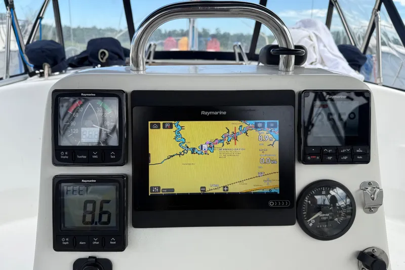 Slide: The Image of Hunter 386 sailboat cockpit with Raymarine navigation instruments, 2004 model. - 11