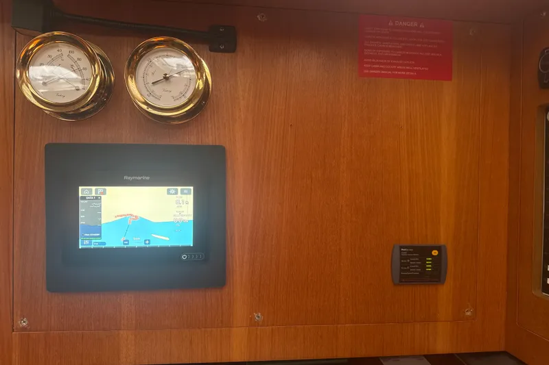 Slide: The Image of Navigation panel with gauges and Raymarine display on 2004 Hunter 386 yacht. - 27