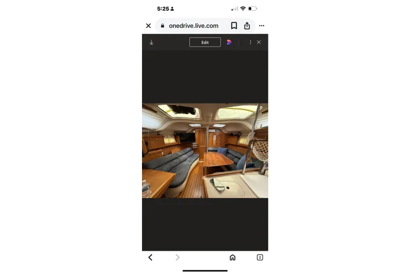 Slide: The Image of Interior of 2004 Hunter 386 sailboat with wooden furnishings and seating area. - 30