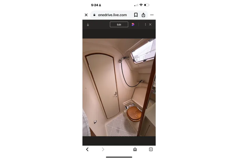 Slide: The Image of Interior of 2004 Hunter 386 sailboat bathroom with shower and wooden toilet seat. - 34