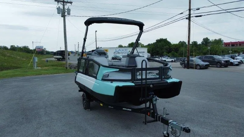Slide: The Image of 2026 Sea-Doo Switch Sport 18 on trailer, parking lot view. - 19