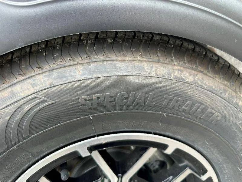 Slide: The Image of Close-up of a special trailer tire, Sea-Doo Switch Sport 18, 2026. - 23