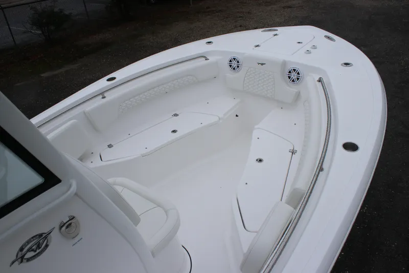 Slide: The Image of 2026 Tidewater 232 LXF boat interior with seating and speakers, showcasing modern design. - 12