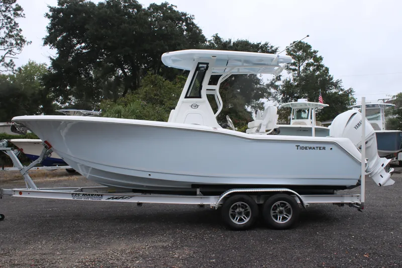 Slide: The Image of 2026 Tidewater 232 LXF boat on trailer, side view, outdoors. - 4