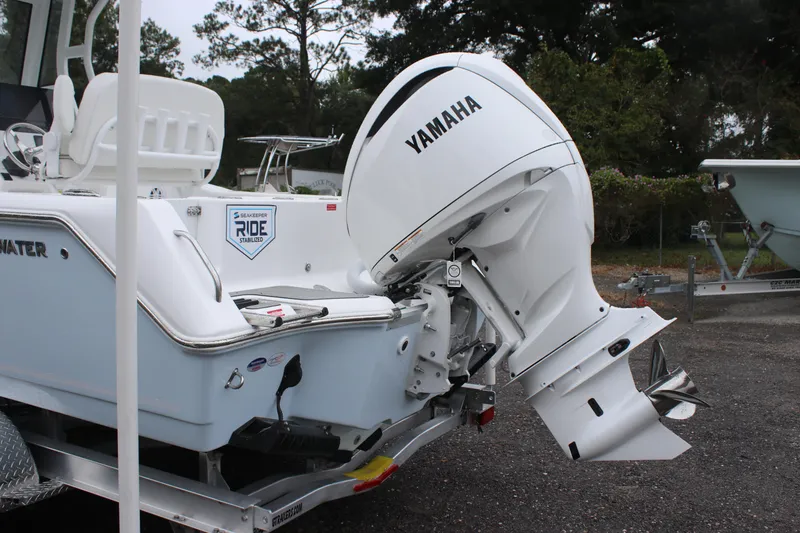Slide: The Image of 2026 Tidewater 232 LXF boat with Yamaha outboard engine, parked on a trailer. - 5