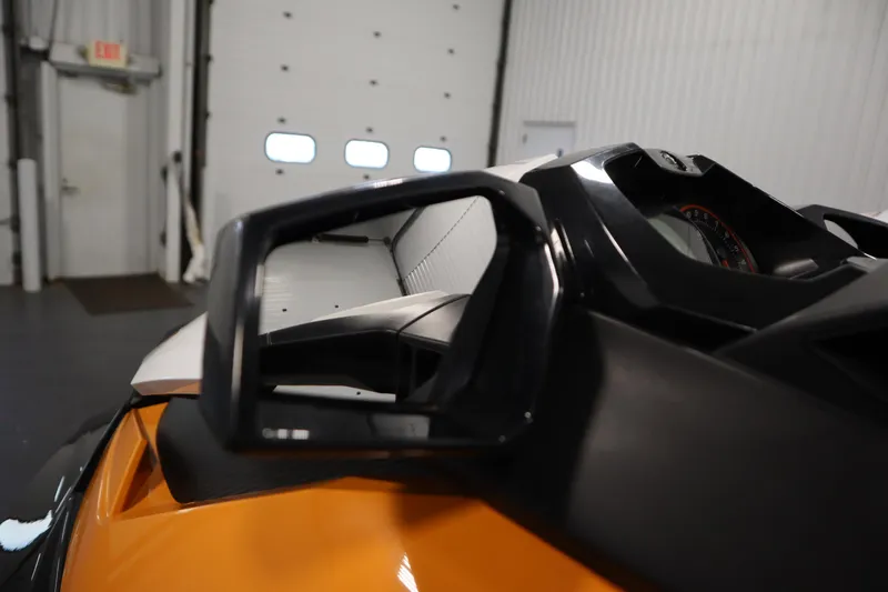 Slide: The Image of 2012 Sea-Doo GTR 215 jet ski dashboard and mirror in a garage setting. - 10