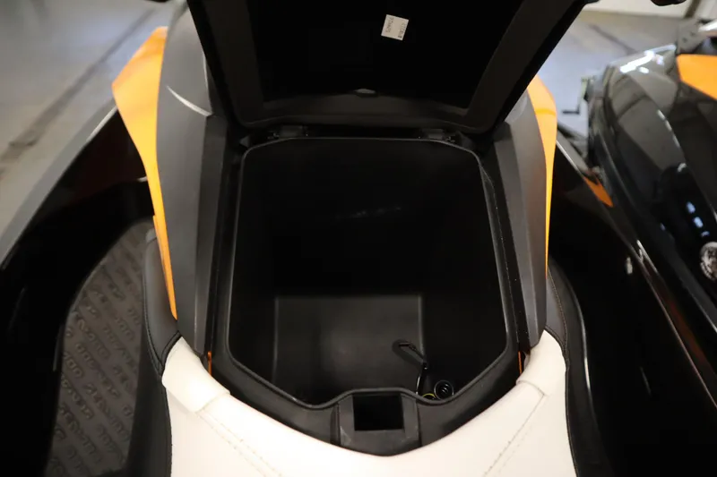 Slide: The Image of 2012 Sea-Doo GTR 215 storage compartment open, showcasing interior space. - 14