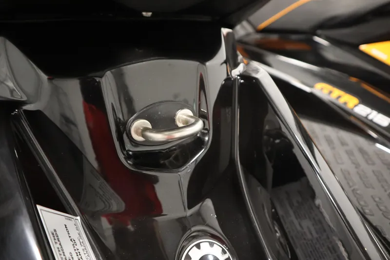 Slide: The Image of Close-up of 2012 Sea-Doo GTR 215 jet ski detail, featuring sleek black design. - 17