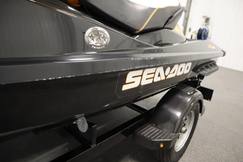 Slide: The Image of 2012 Sea-Doo GTR 215 jet ski on trailer, featuring ultra-low emission badge. - 21