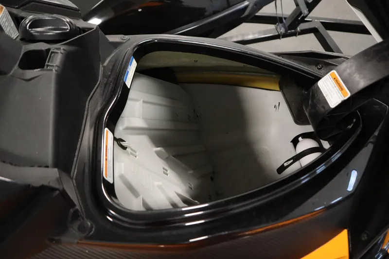 Slide: The Image of 2012 Sea-Doo GTR 215 storage compartment, open and empty, showcasing interior space. - 22