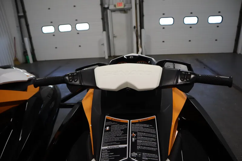 Slide: The Image of 2012 Sea-Doo GTR 215 jet ski handlebars and dashboard in a garage setting. - 24