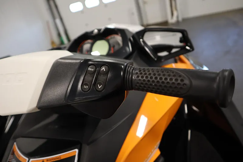 Slide: The Image of 2012 Sea-Doo GTR 215 handlebar controls, featuring mode and set buttons. - 25