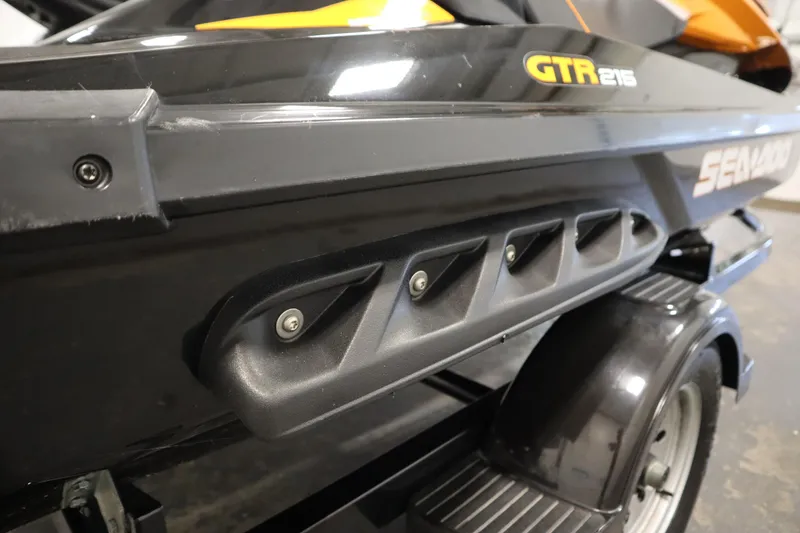 Slide: The Image of 2012 Sea-Doo GTR 215 jet ski on trailer, close-up view. - 34