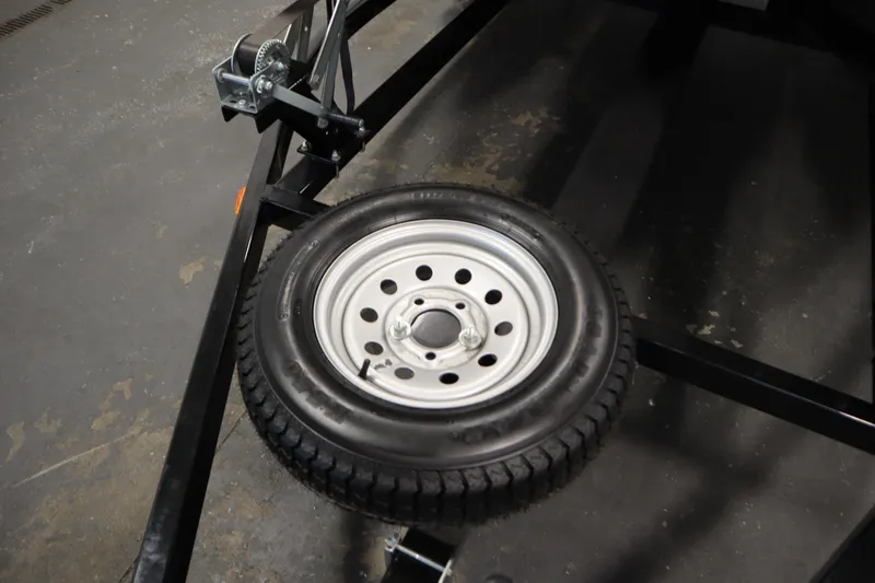 Slide: The Image of Trailer with spare tire for 2012 Sea-Doo GTR 215, featuring a mounted winch. - 35