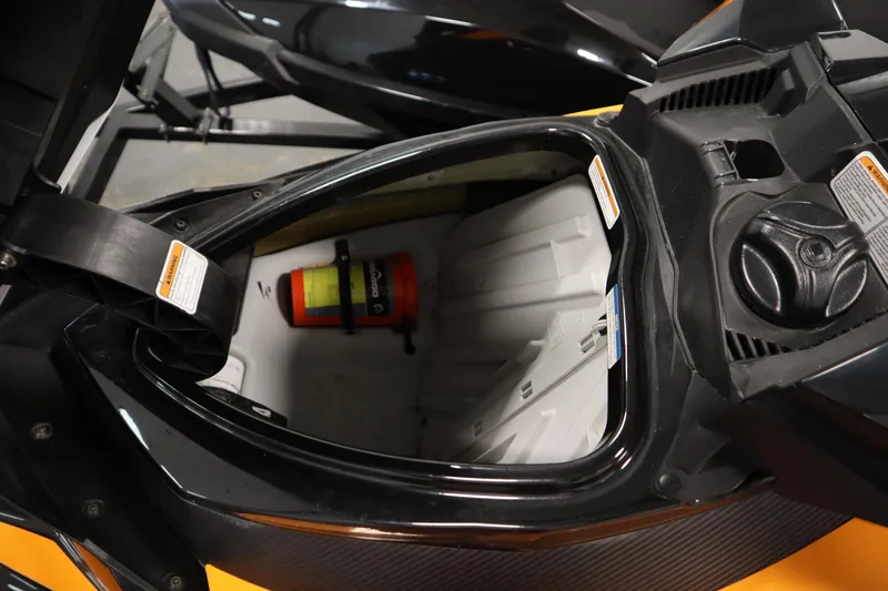 Slide: The Image of 2012 Sea-Doo GTR 215 storage compartment with safety equipment inside. - 9