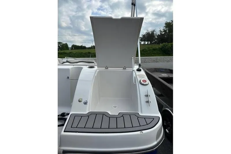 Slide: The Image of 2021 Starcraft 1915 OB Limited boat with open storage compartment, outdoor setting. - 10