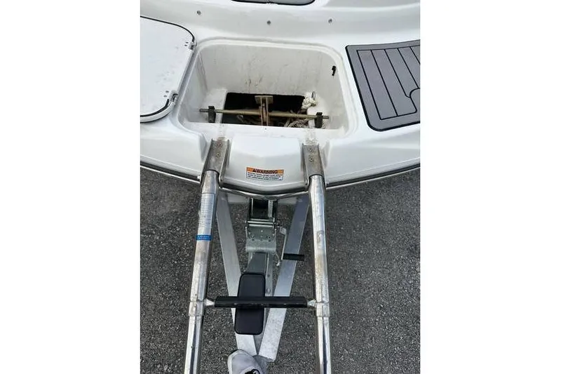 Slide: The Image of 2021 Starcraft 1915 OB Limited boat ladder and storage compartment detail. - 12