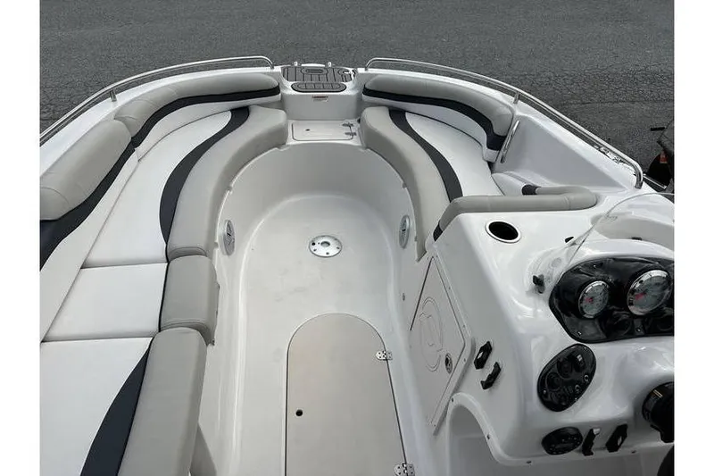 Slide: The Image of 2021 Starcraft 1915 OB Limited boat interior with spacious seating and modern dashboard. - 18