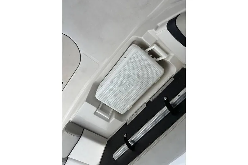 Slide: The Image of 2021 Starcraft 1915 OB Limited boat interior with Igloo cooler storage compartment. - 23