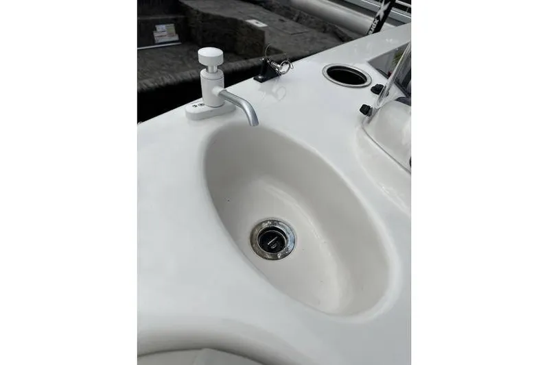 Slide: The Image of 2021 Starcraft 1915 OB Limited boat sink with faucet and cup holder. - 28