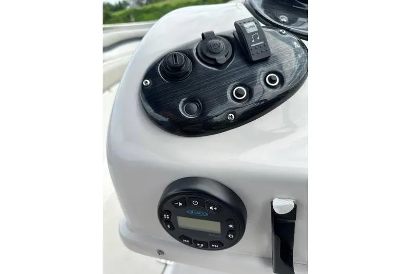 Slide: The Image of 2021 Starcraft 1915 OB Limited boat dashboard with controls and audio system. - 31
