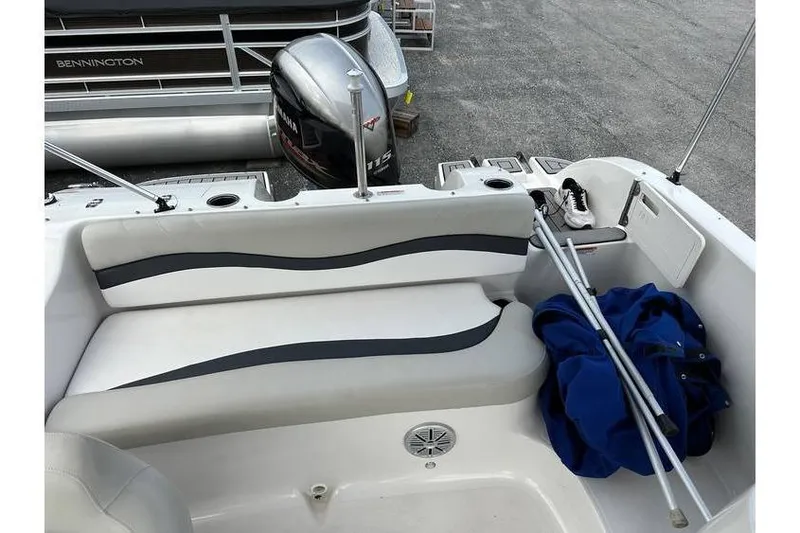 Slide: The Image of 2021 Starcraft 1915 OB Limited boat interior with seating and Yamaha outboard motor. - 32