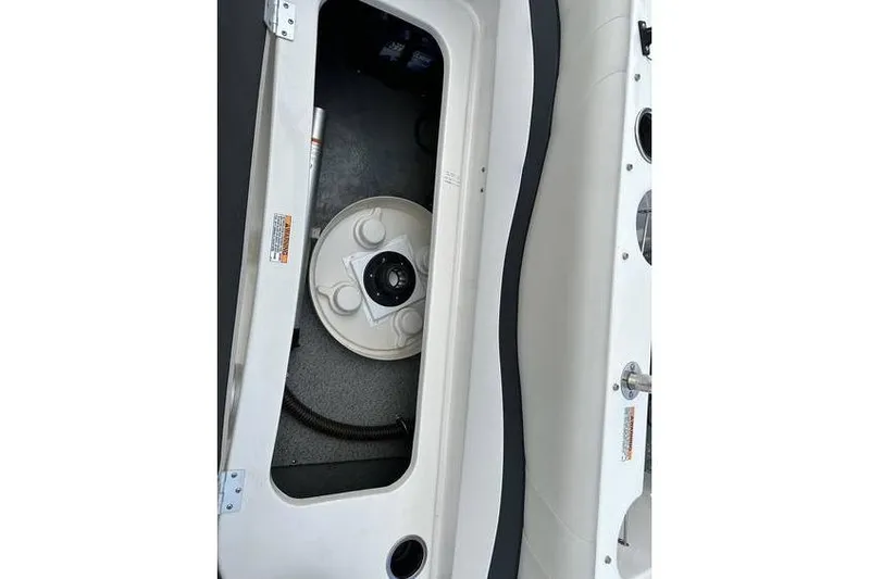 Slide: The Image of 2021 Starcraft 1915 OB Limited boat storage compartment with visible hatch and interior details. - 33