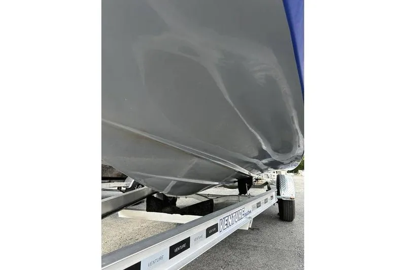 Slide: The Image of 2021 Starcraft 1915 OB Limited boat on Venture trailer, side view. - 35