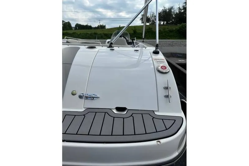 Slide: The Image of 2021 Starcraft 1915 OB Limited boat, rear view with sleek design and deck details. - 9