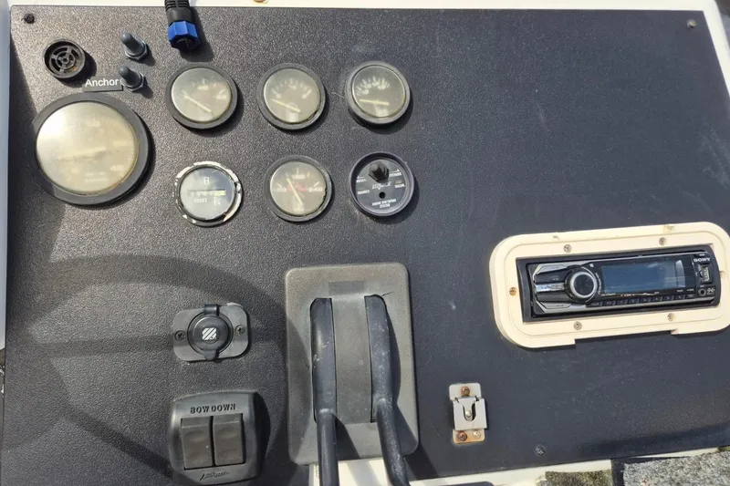 Slide: The Image of Control panel of 1991 Carver 36 Aft Cabin Motor Yacht with gauges and stereo system. - 12