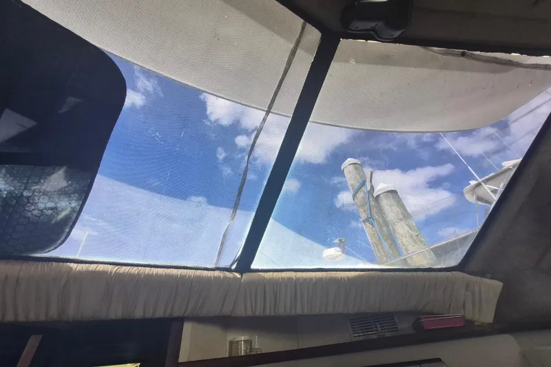 Slide: The Image of Interior view from a 1991 Carver 36 Aft Cabin Motor Yacht, showing sky through windows. - 26