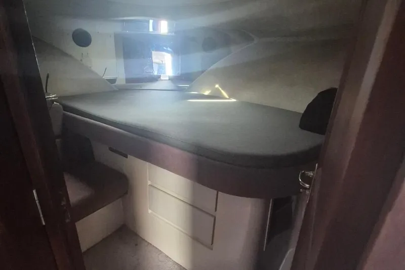 Slide: The Image of Interior cabin of 1991 Carver 36 Aft Cabin Motor Yacht, featuring a cozy sleeping area. - 29