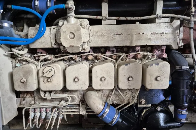 Slide: The Image of Engine of a 1991 Carver 36 Aft Cabin Motor Yacht, showing detailed components. - 38