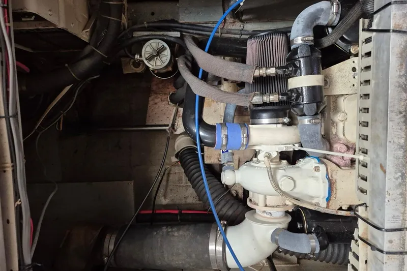 Slide: The Image of Engine compartment of a 1991 Carver 36 Aft Cabin Motor Yacht, showing hoses and components. - 41