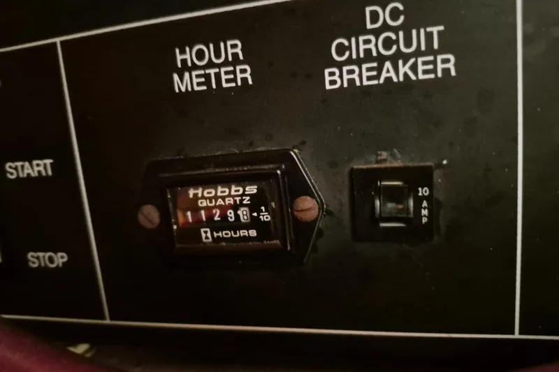 Slide: The Image of Hour meter and DC circuit breaker on 1991 Carver 36 Aft Cabin Motor Yacht. - 43