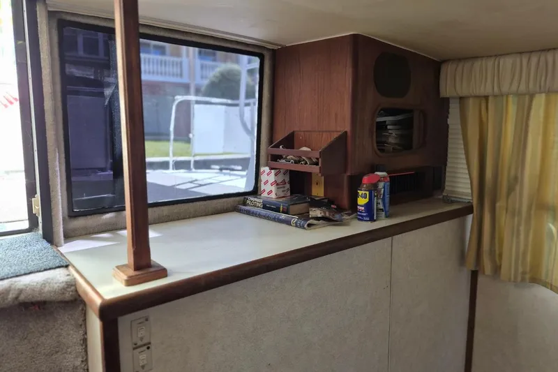 Slide: The Image of Interior of 1991 Carver 36 Aft Cabin Motor Yacht with window and storage area. - 16